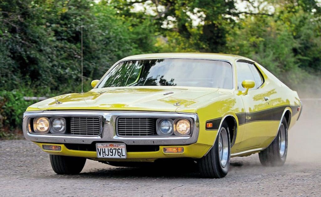 Bright yellow 1973 Charger 440 on the road