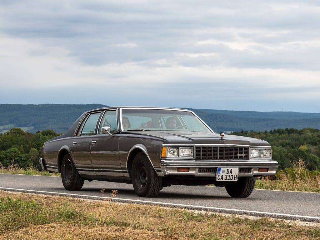 Driving a Chevy Caprice down a road