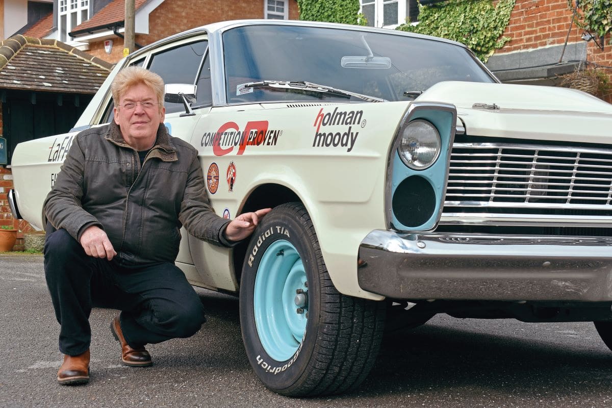 Dave crouching beside his Ford Custom