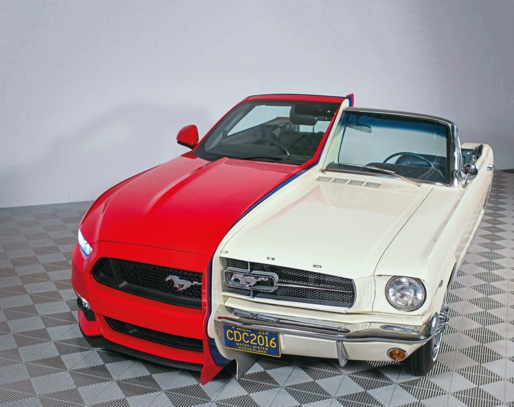 Half of a new 2015 Mustang and half of a 1965 Mustang, split down the middle and pushed together.