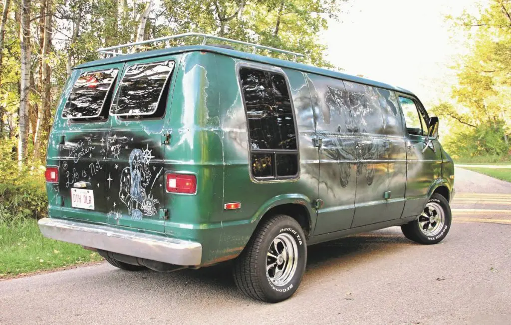 Green 1977 Dodge Tradesman 200 boogie van with murals.