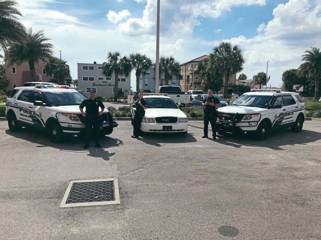 Ewan's Crown Vic with three other American police cars and three police officers in Florida.