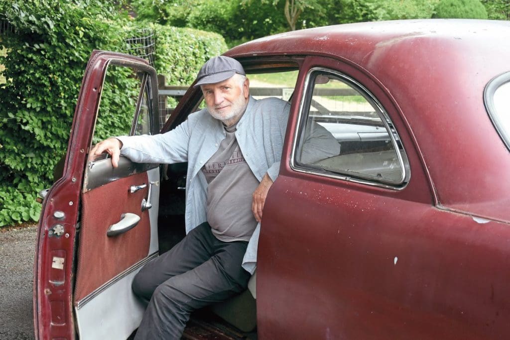 Owner Delwyn in his 1950 Ford Custom Club Coupe