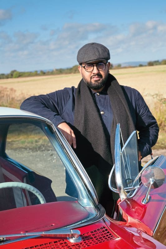 Owner Tamir Ali leans against his 1961 Buick Invicta