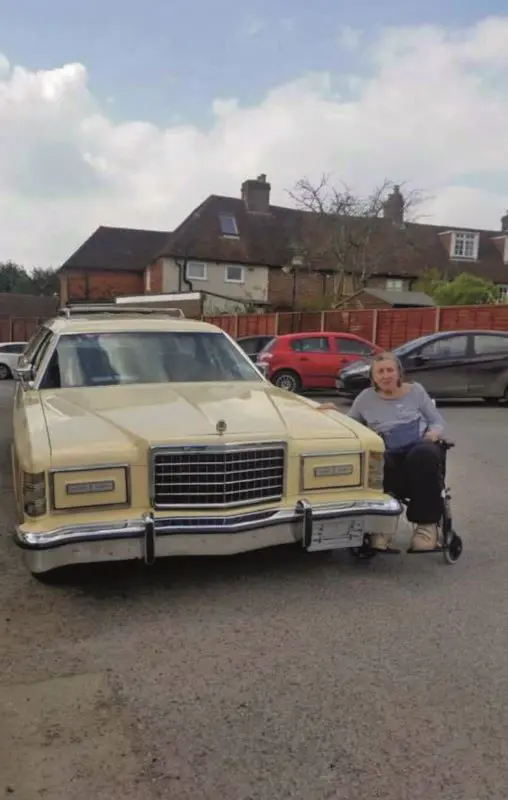 Mrs Grimes senior besides the 1978 Ford Country Squire.