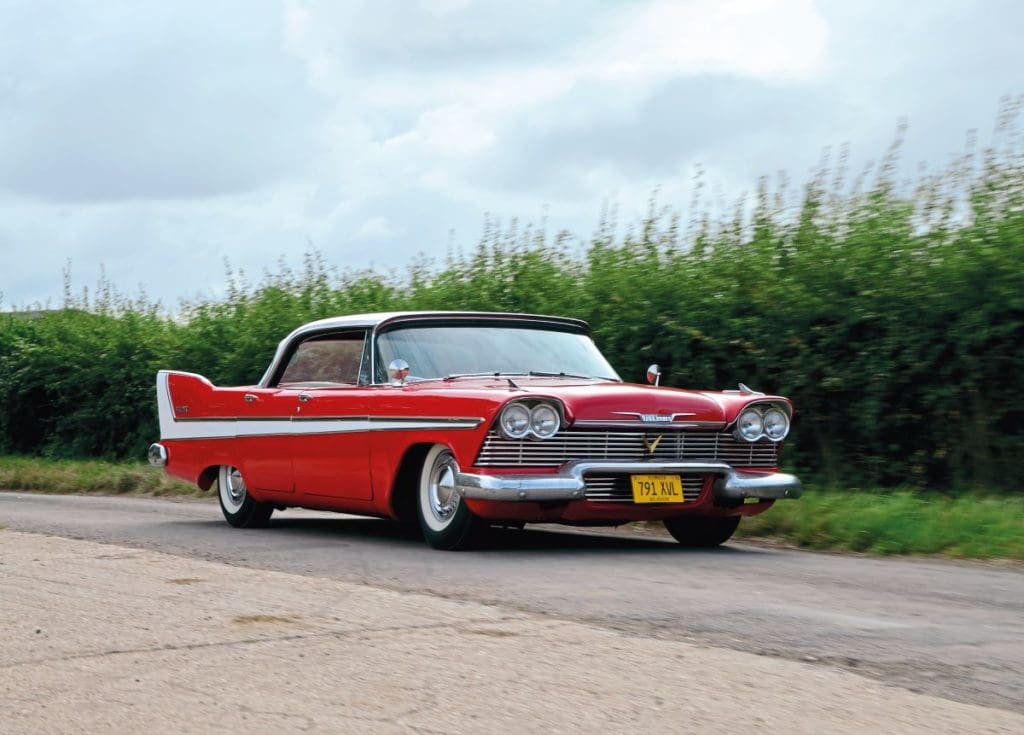 1958 Plymouth Belvedere driving along road