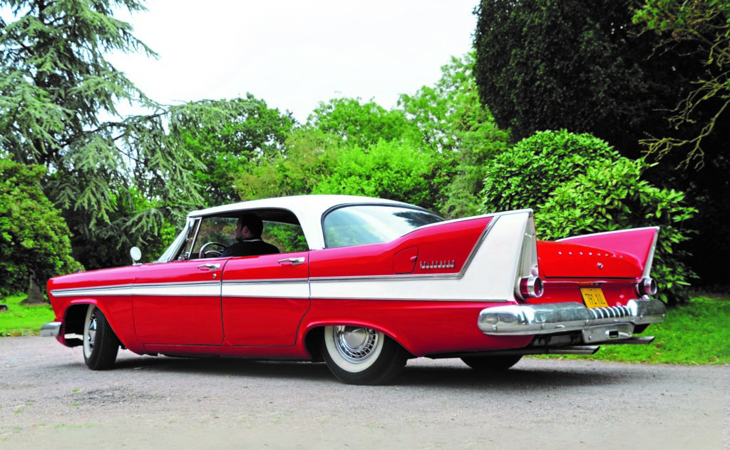 Parked red 1958 Plymouth Belvedere