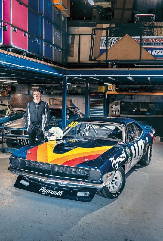 Matt Snowball stands next to the Dan Gurney Plymouth 'Cuda he built in his garage 