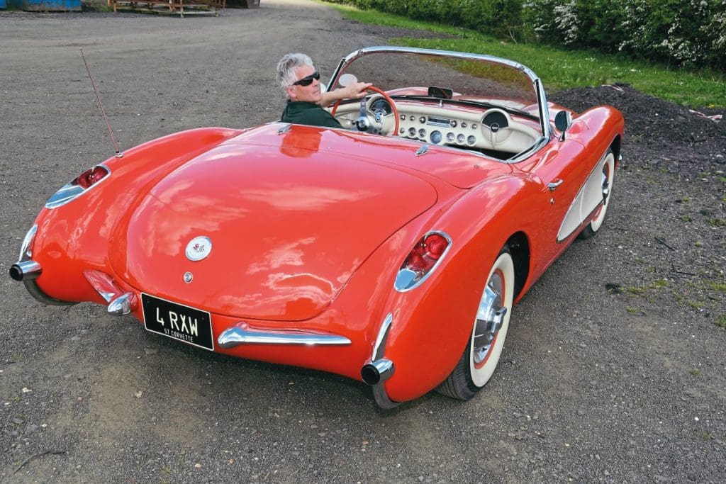 1957 Corvette Roadster from the back with Ben in the driver's seat