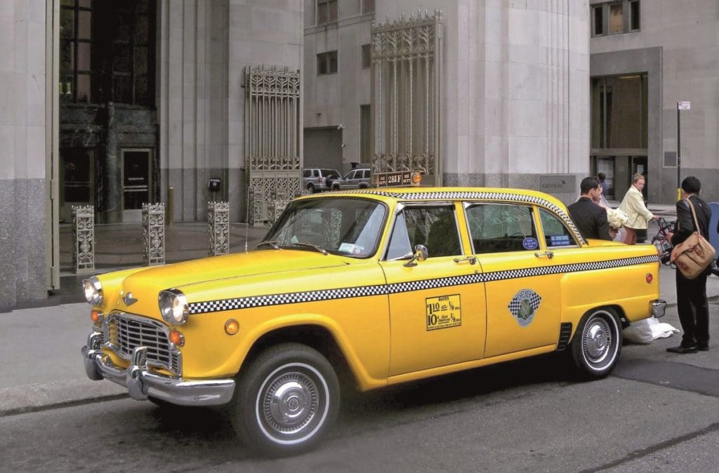 Yellow Checker taxi parked on the streets of New York City