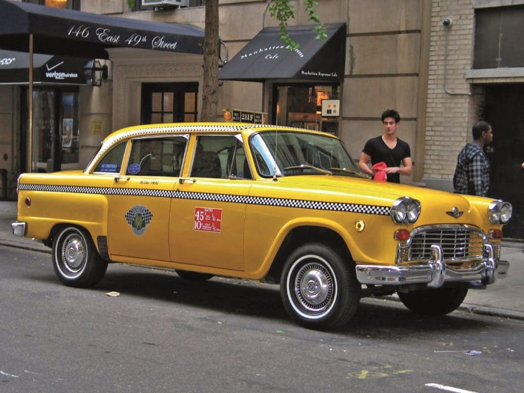 Yellow Checker taxi cab parked on the streets of New York City