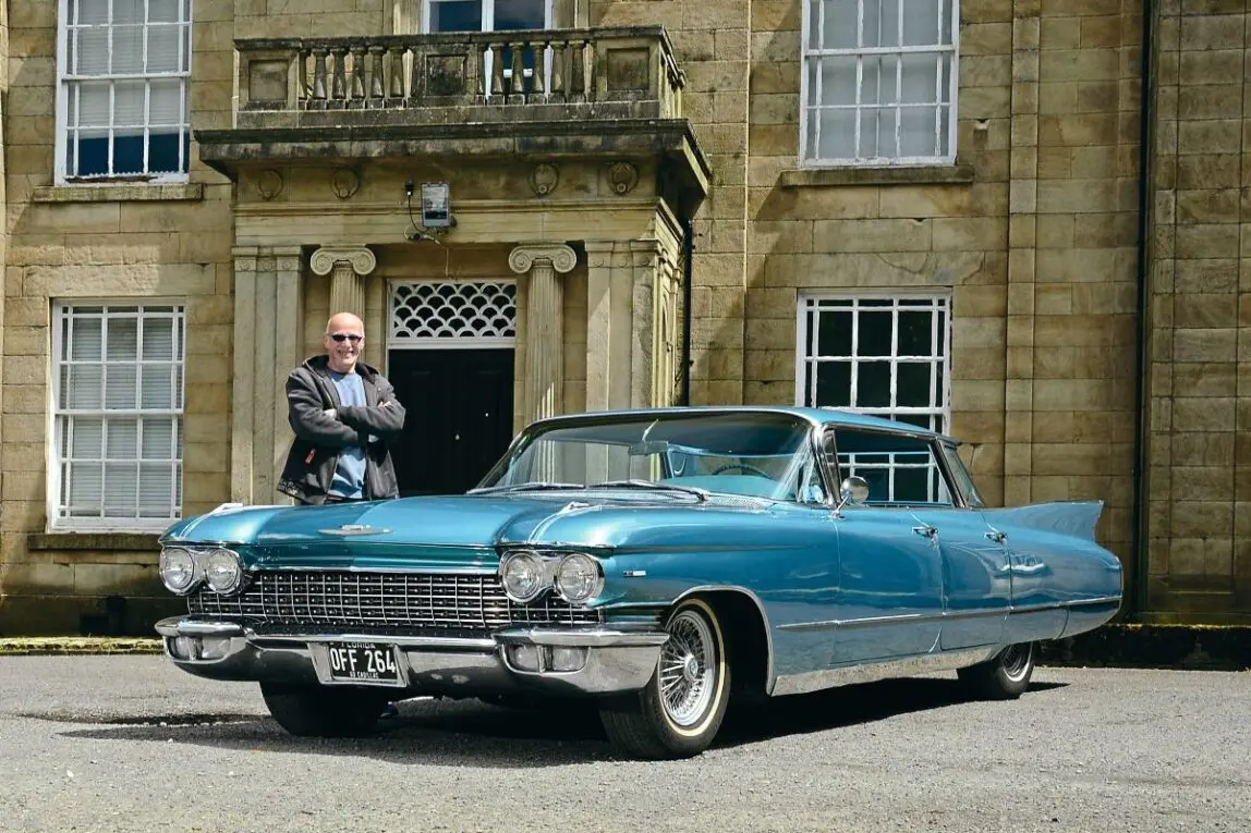Big 1960 Cadillac Series 62 in a small town